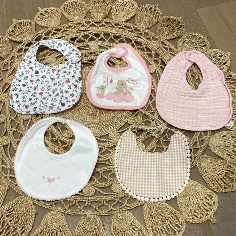 Bundle up with five baby girl bibs